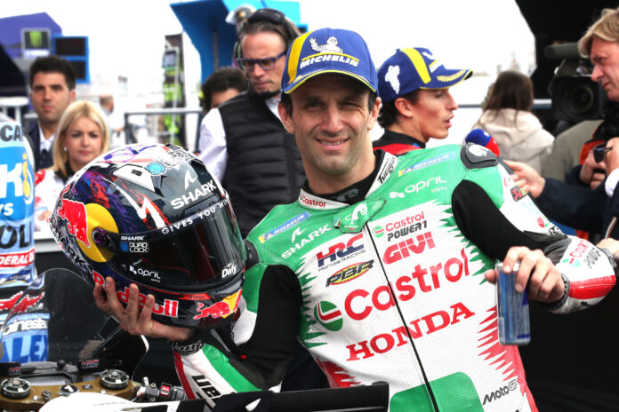 MotoGP World Championship 2025 Stop 02 - Termas De Rio Hondo, Argentina a man holding a helmet
