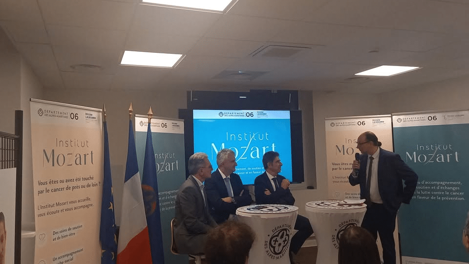 men around a table discussing the fight against cancer